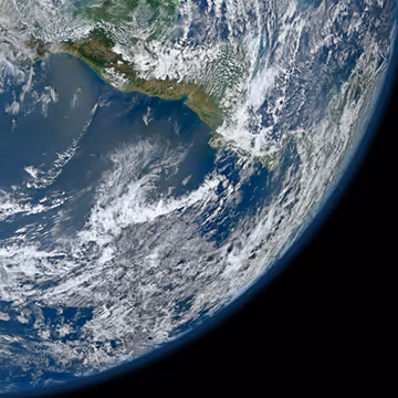 Satellite view of Earth's curved surface showing land, ocean, and swirling white clouds.