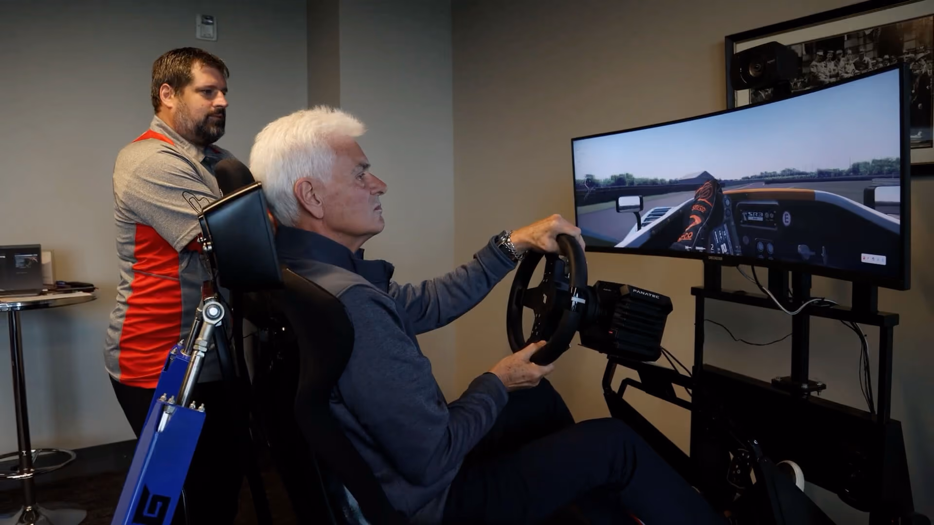 Person using a racing simulator at M1 Concourse