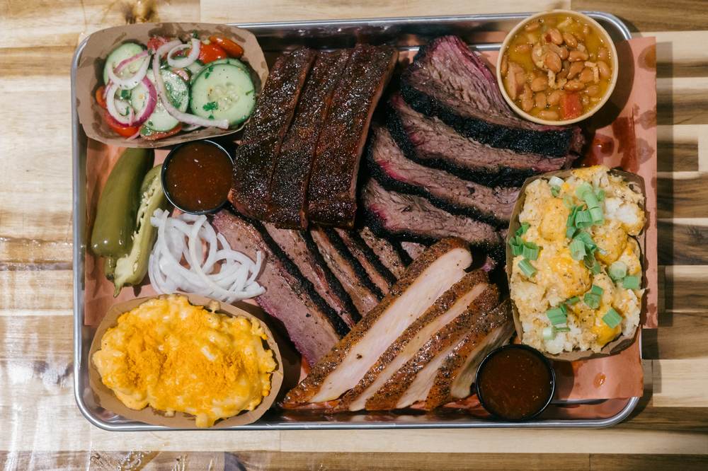 A tray of Baare brisket, ribs, turkey and sides