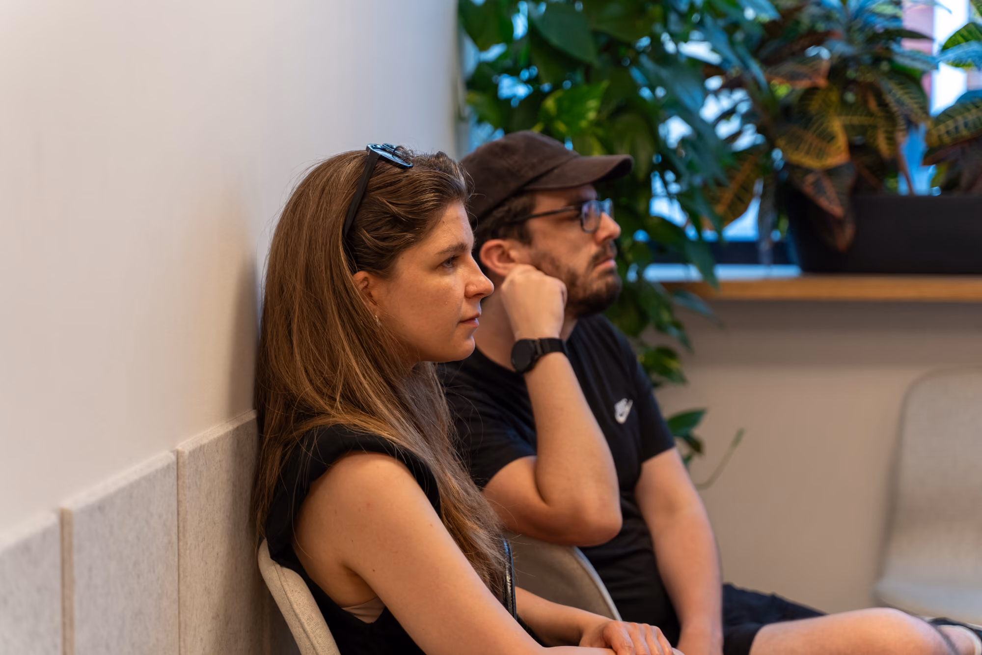 People listening to the presentation in the back row.