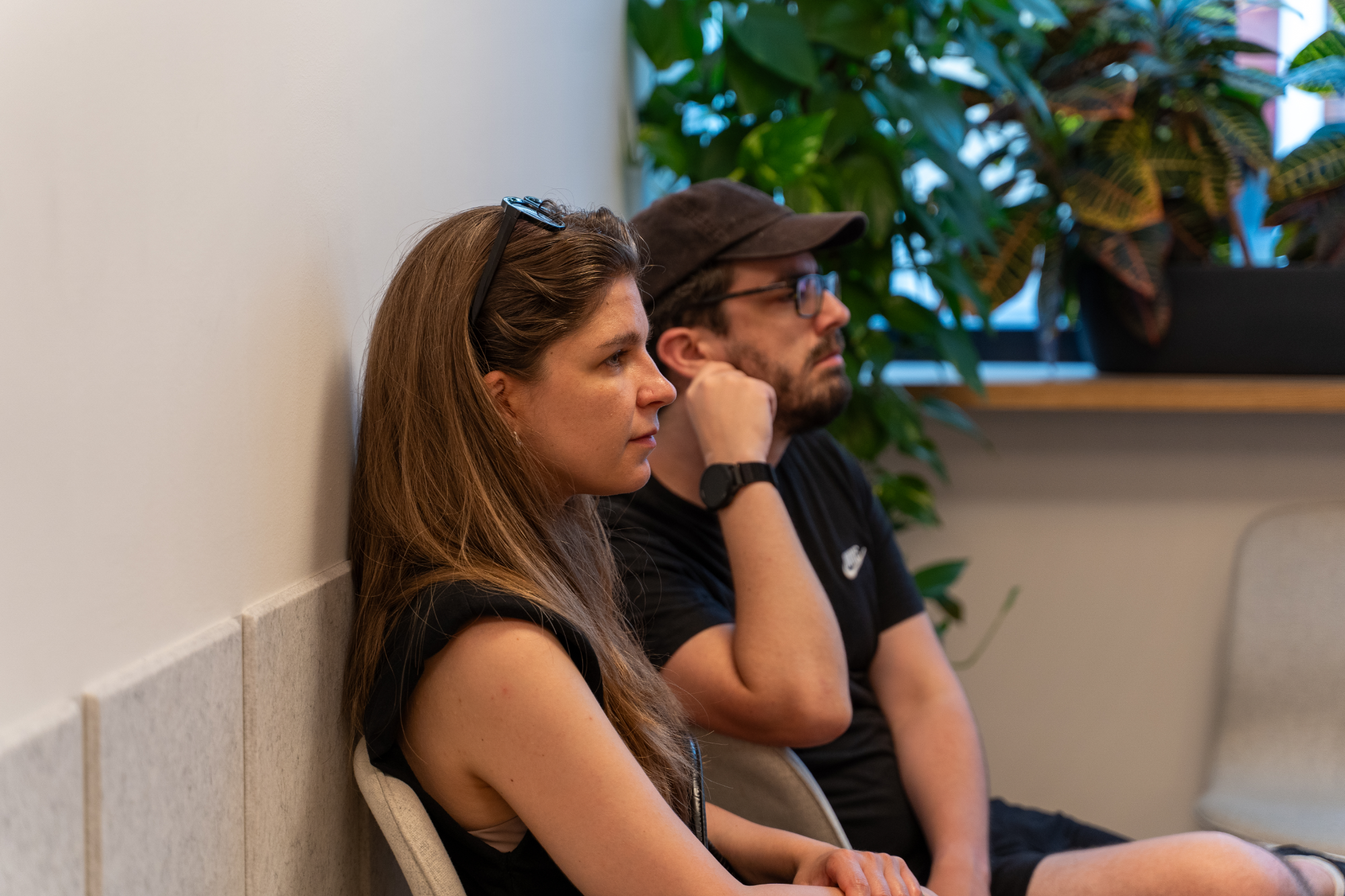 People listening to the presentation in the back row.