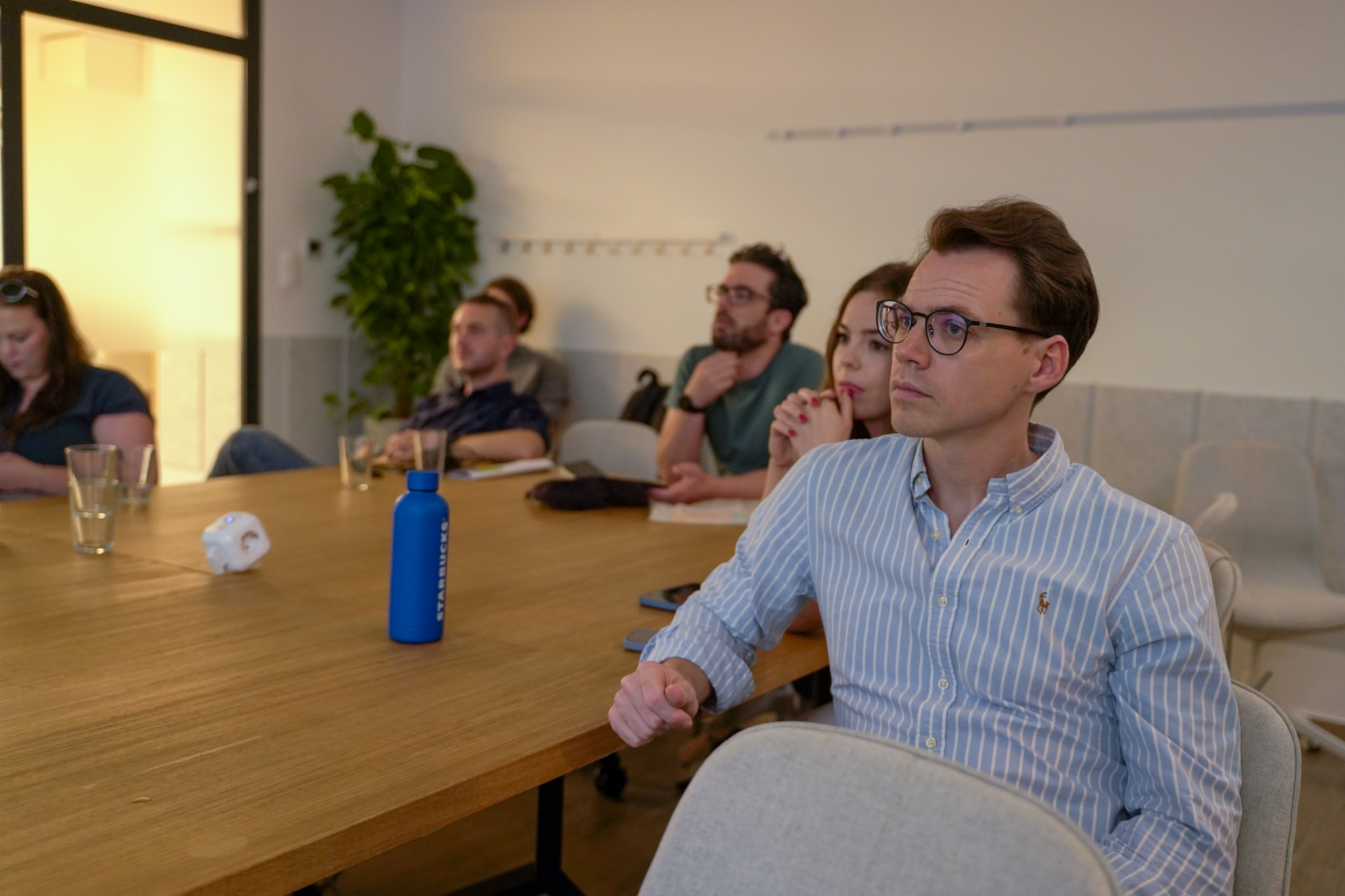 People paying attention to presentation.
