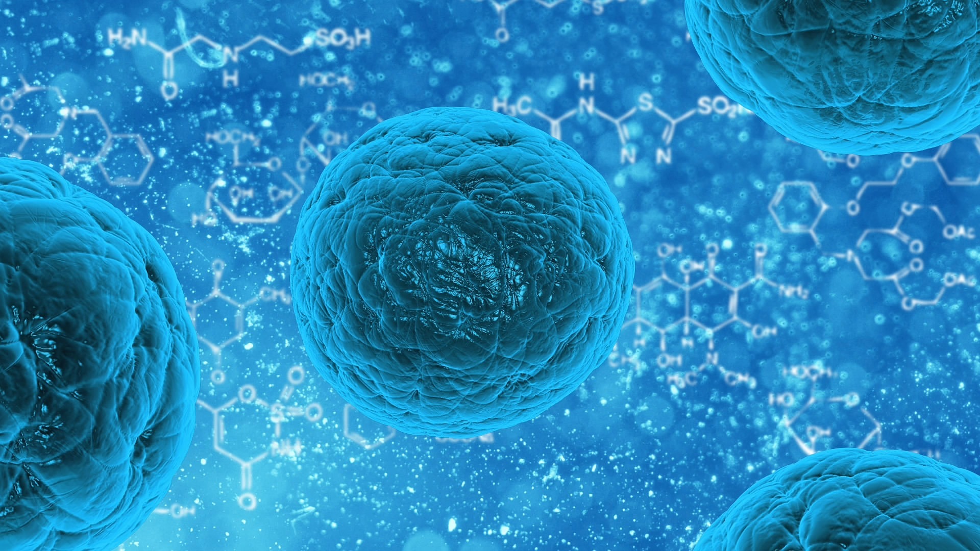Close-up of blue spherical bacteria cells with chemical formulas in the blurry background.
