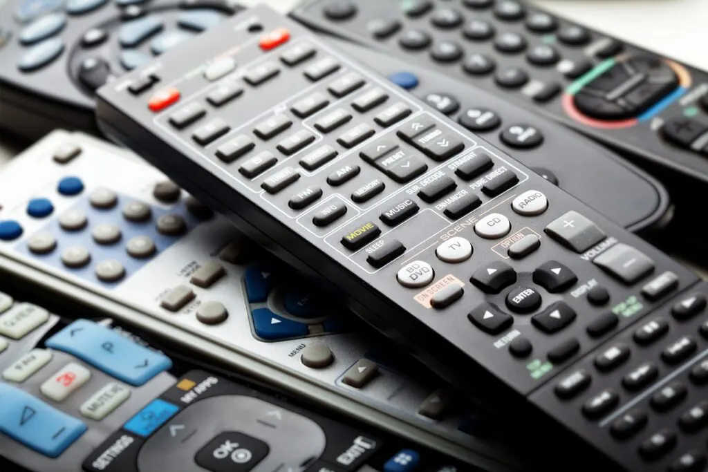 A collection of remotes can confuse guests.