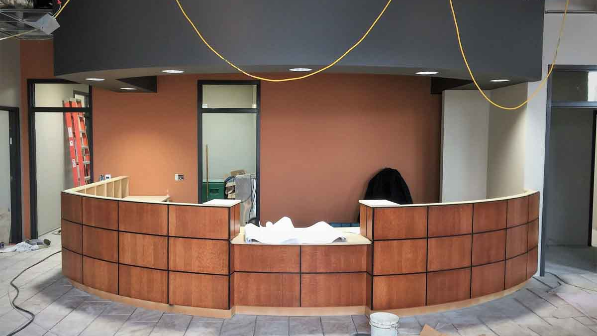 An image of a rounded architectural designed reception desk 