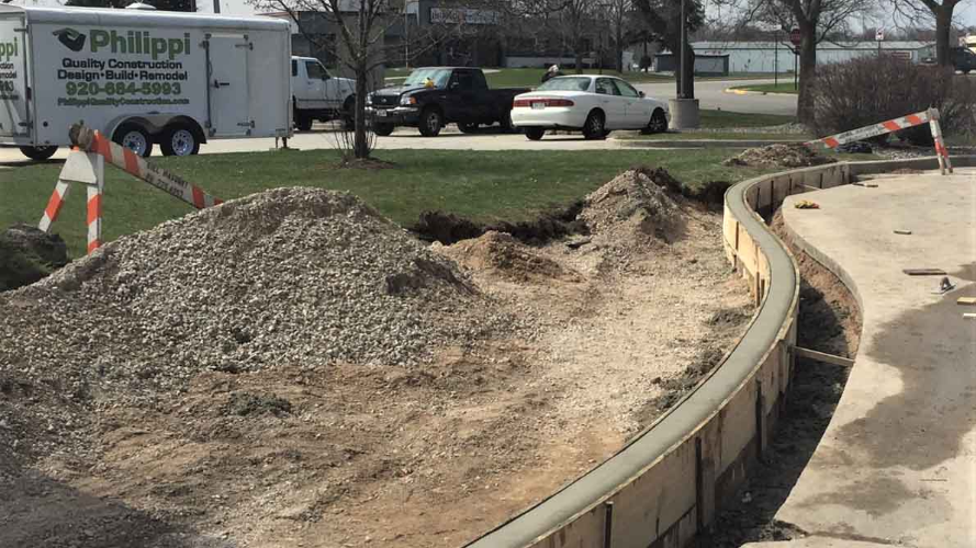 An image of concrete forms creating a retaining wall
