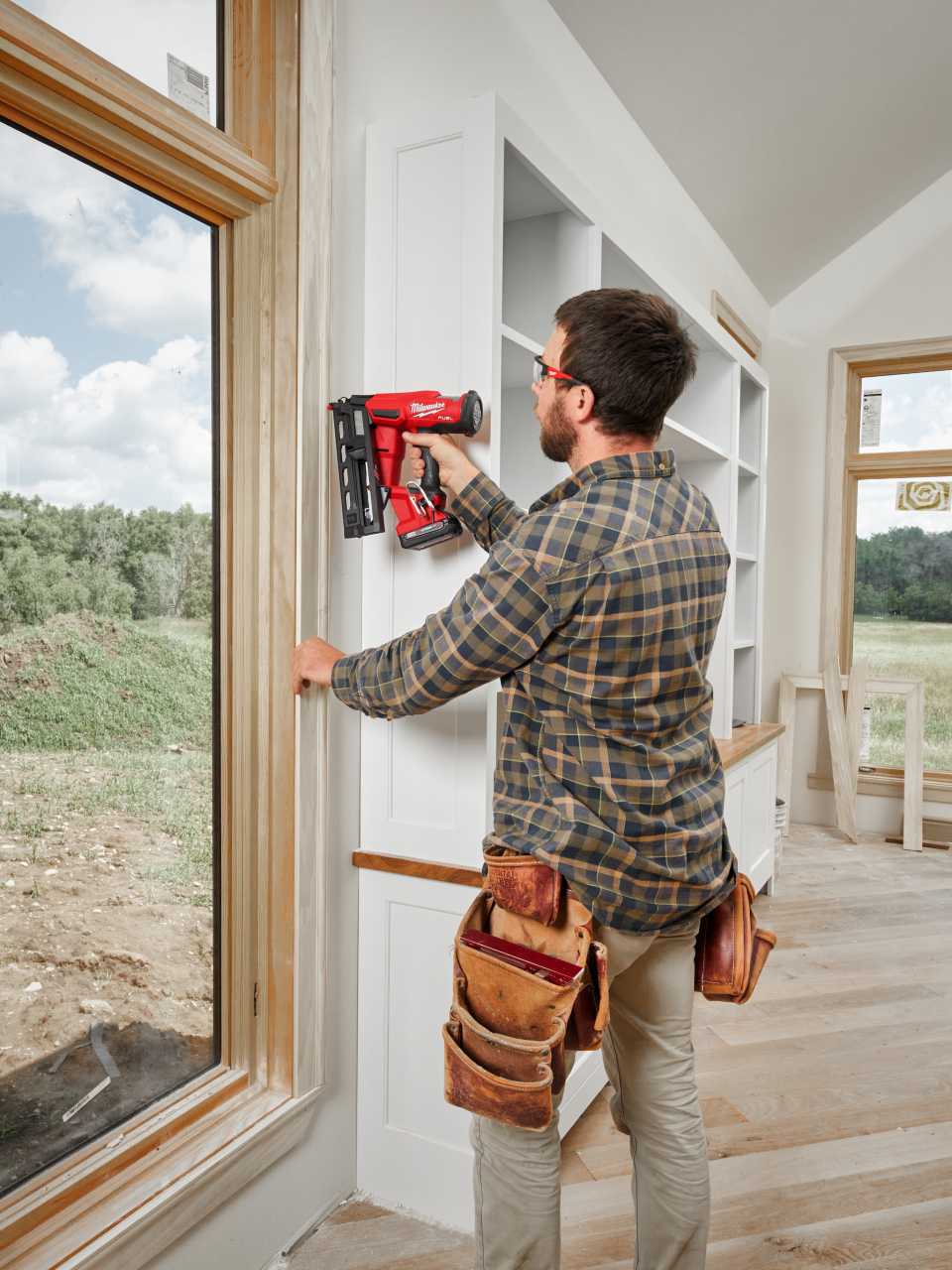 A finish carpenter adding molding to a project.