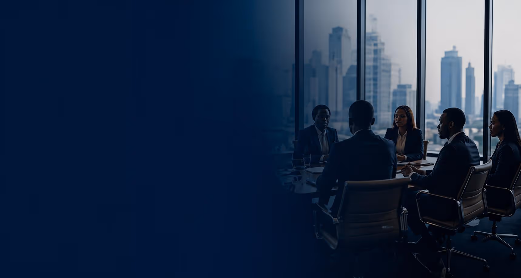 Five business professionals seated around a conference table in a high-rise office with city skyline visible through large windows.