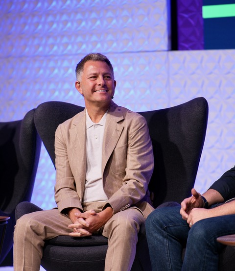 Barry Poznick speaking on conference stage