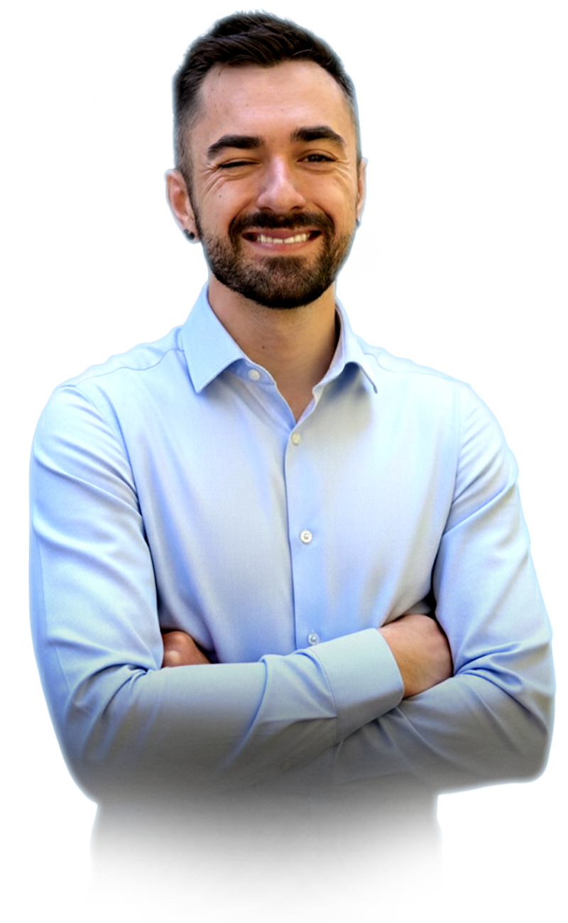 Noah smiling with his arms crossed