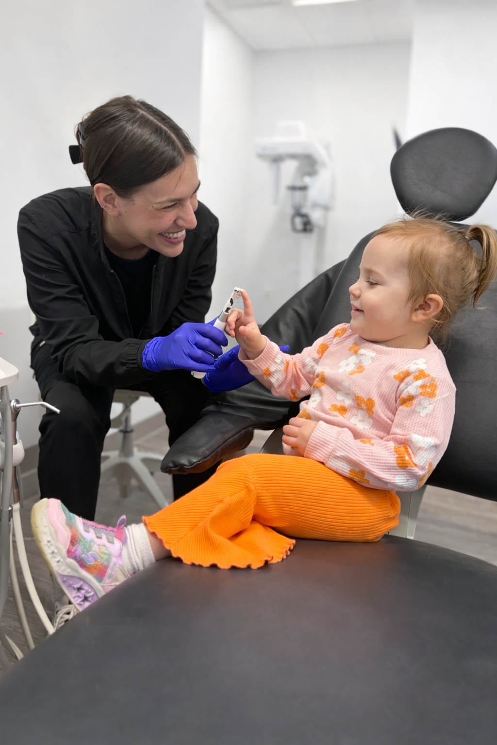 2 year old smiling at pediatric dentist during cleaning at Lawrenceburg pediatric dentistry