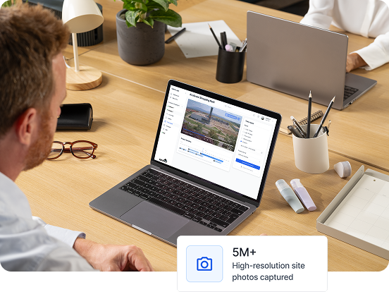 Man working on a laptop showing a desktop app with a photo editing interface and a label stating 5M+ high-resolution site photos captured.