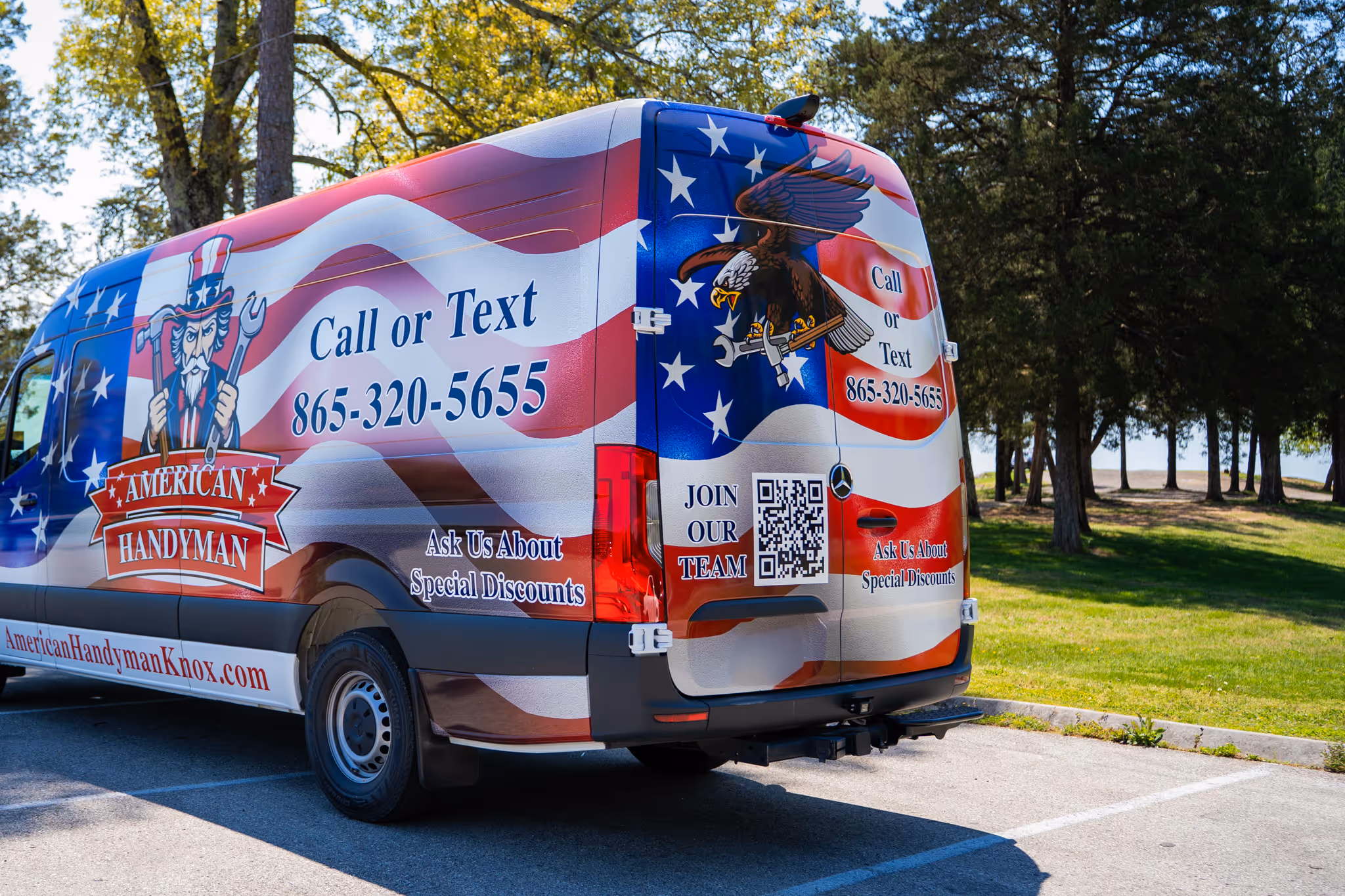 American Handyman service van with patriotic red, white, and blue design and an eagle holding tools, displaying contact number 865-320-5655 and a QR code.