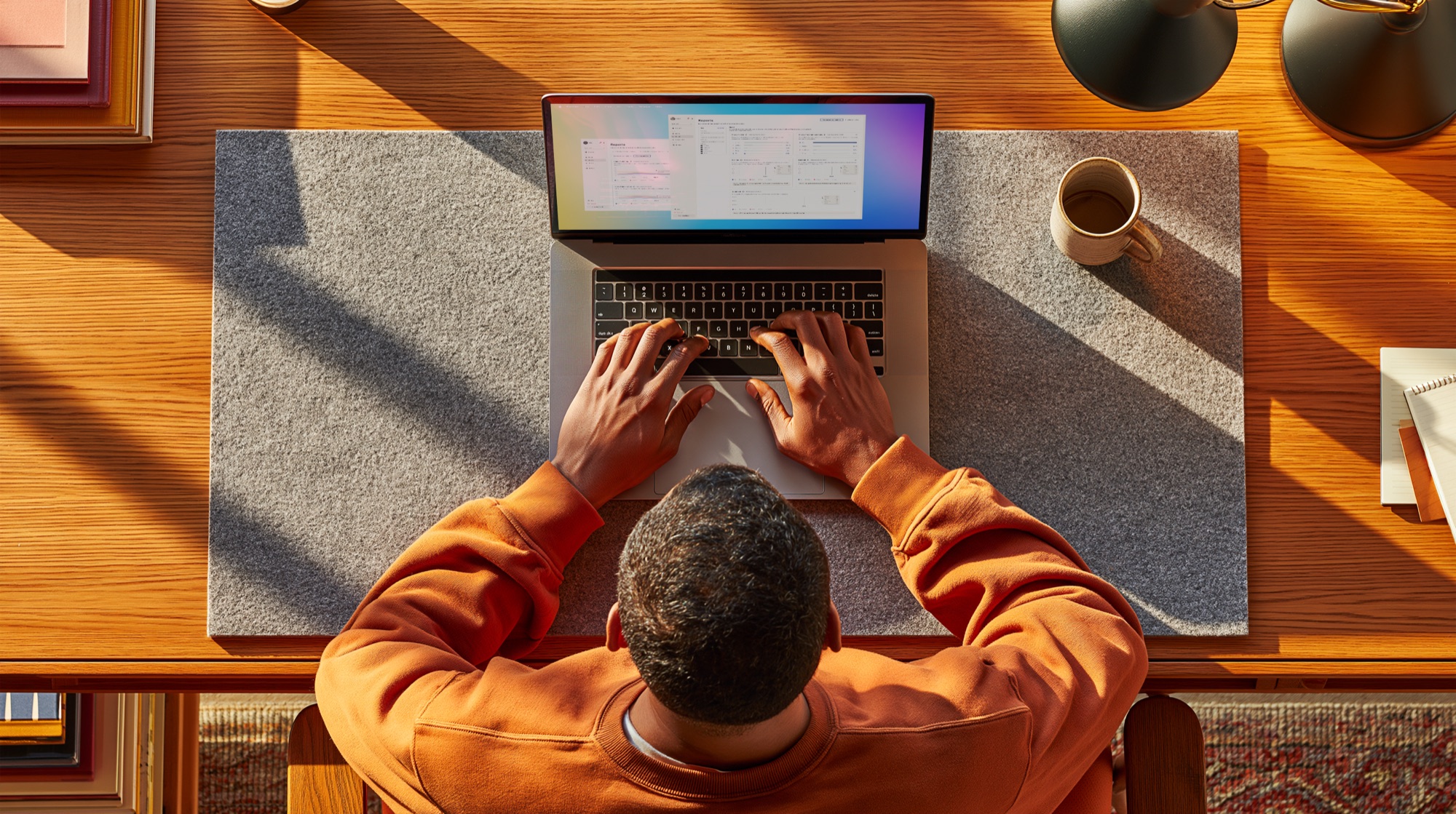 Overhead view of a marketer working on a laptop