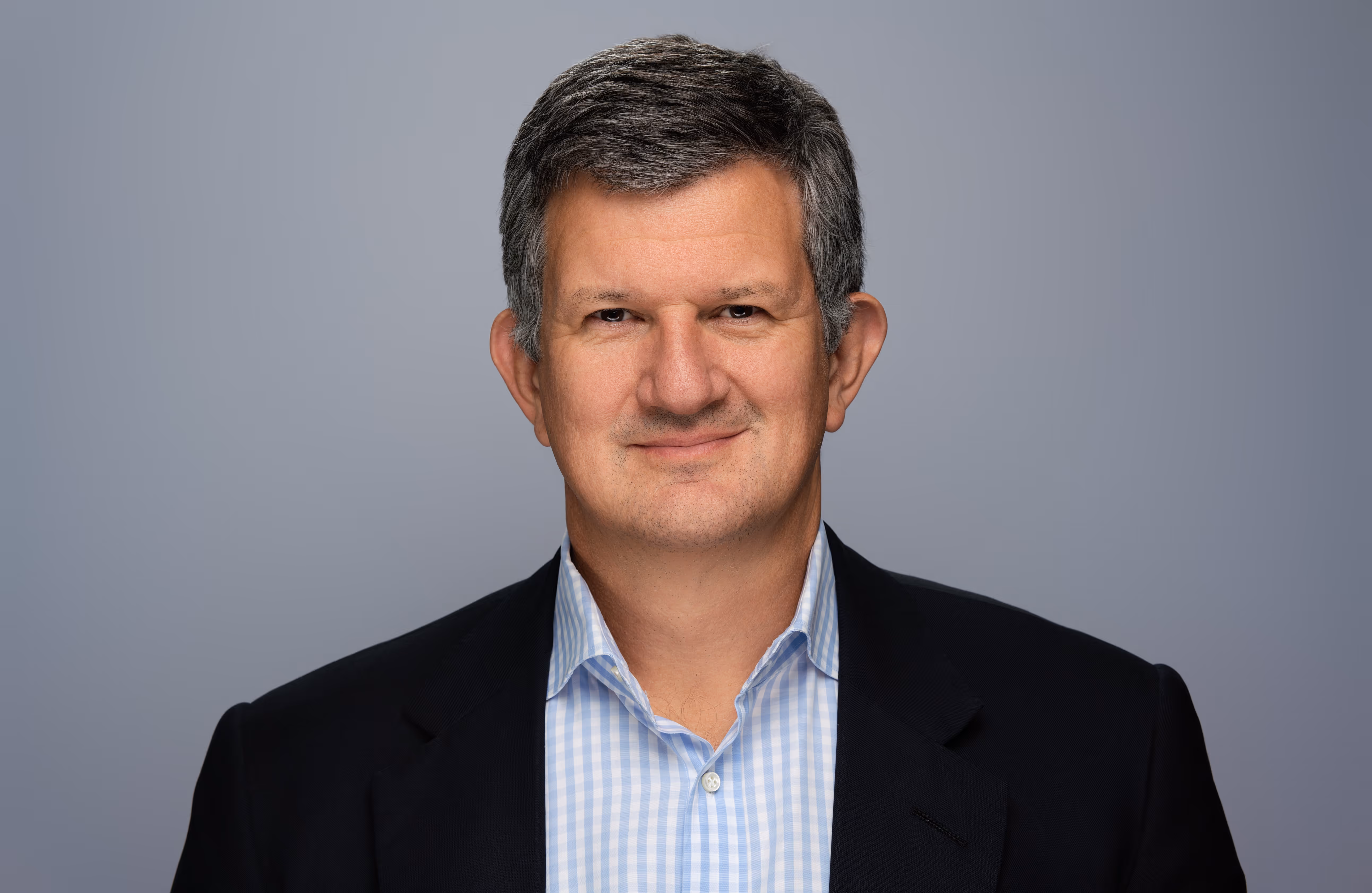 Headshot of Steve Hasker, CEO of Thomson Reuters