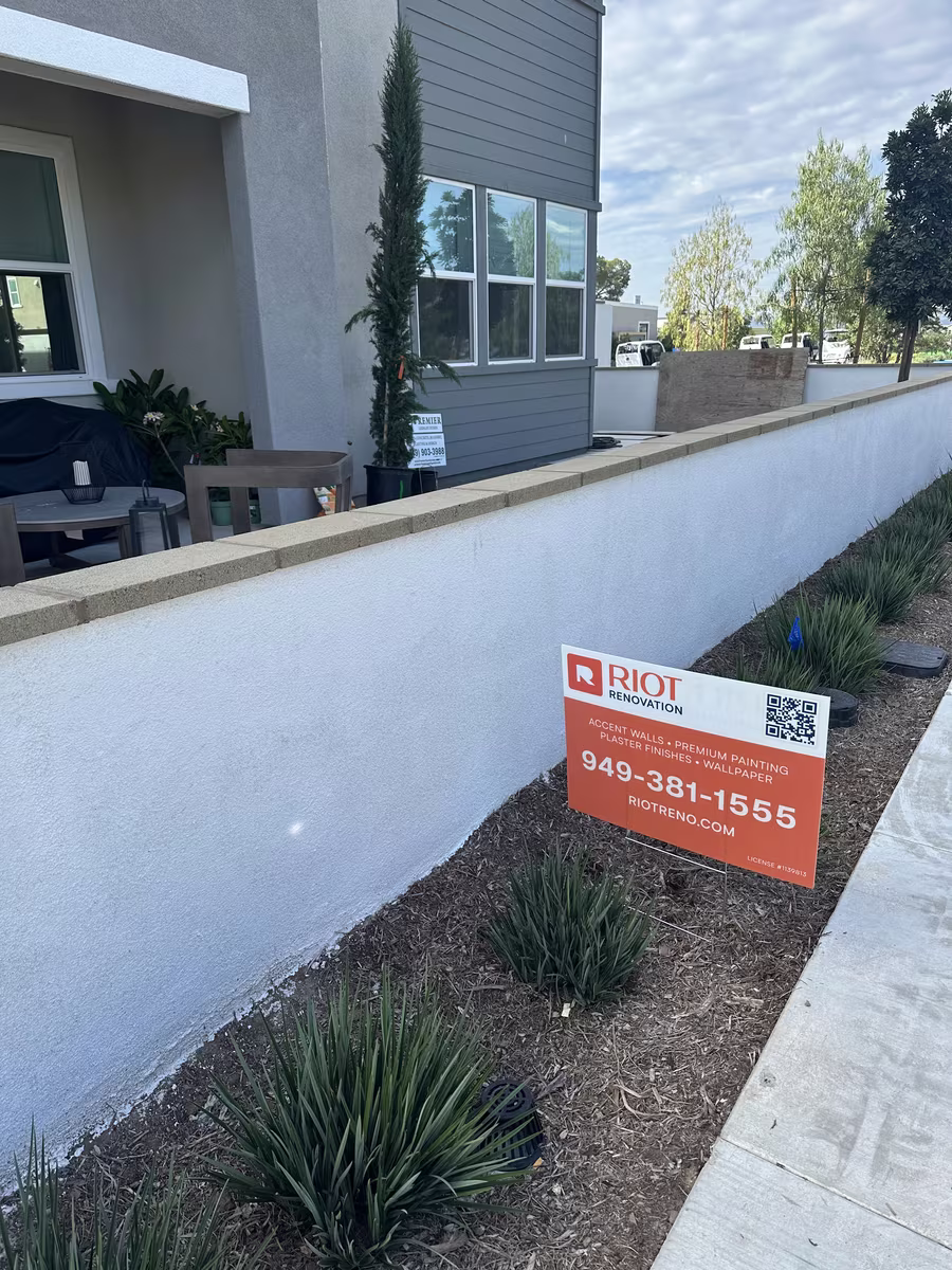 Riot Renovation branded yard sign on residential job