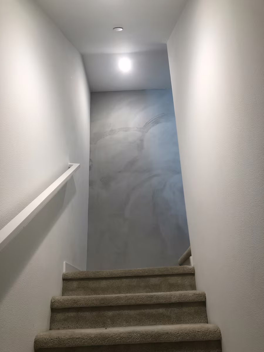 Roman clay accent wall compared to microcement finish