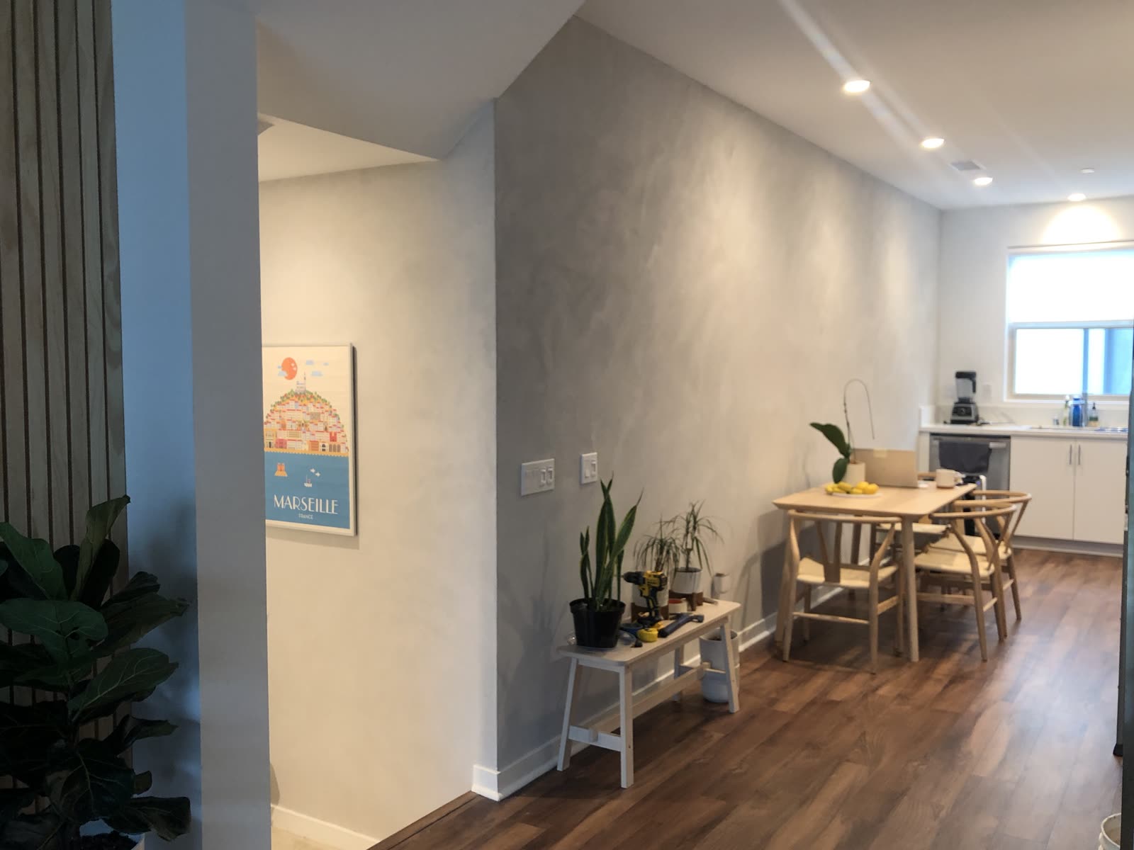 Hand applied clay plaster on a long dining room wall, Orange County