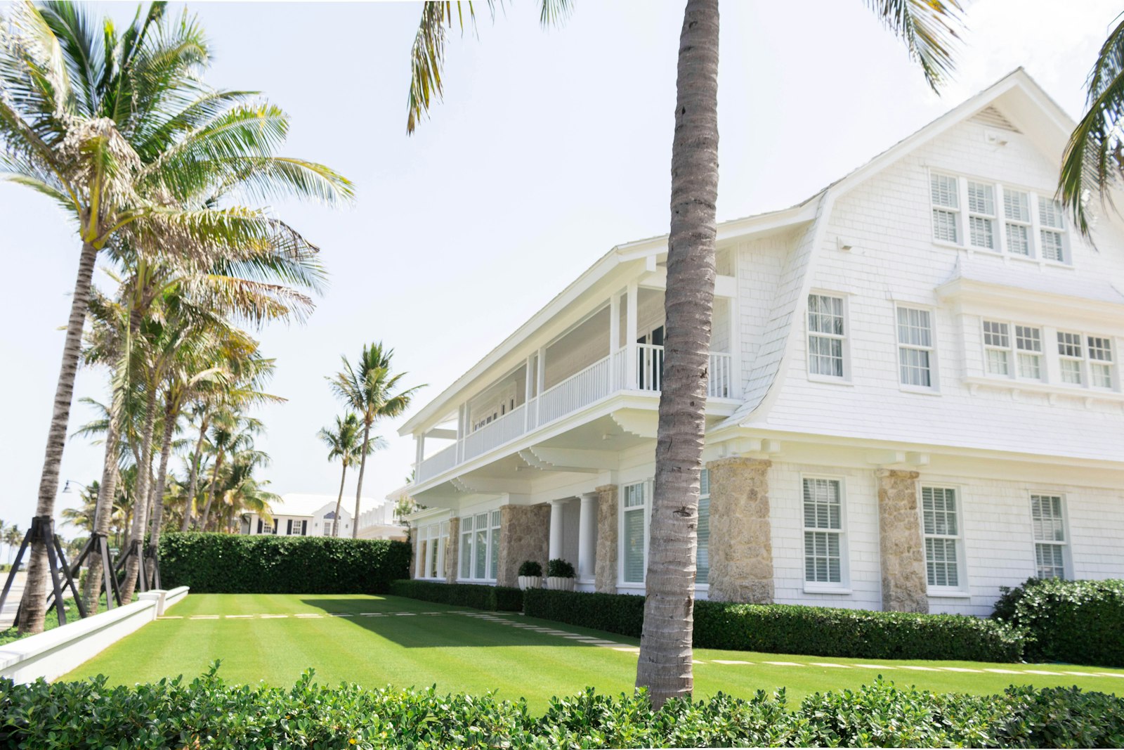 Single-family Florida home framed by palm trees