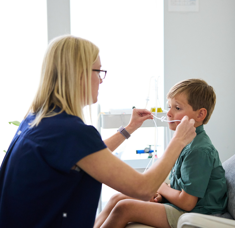 pediatric functional medicine provider with child at restore and revive