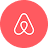 Airbnb logo with a white stylized A inside a red circular background.