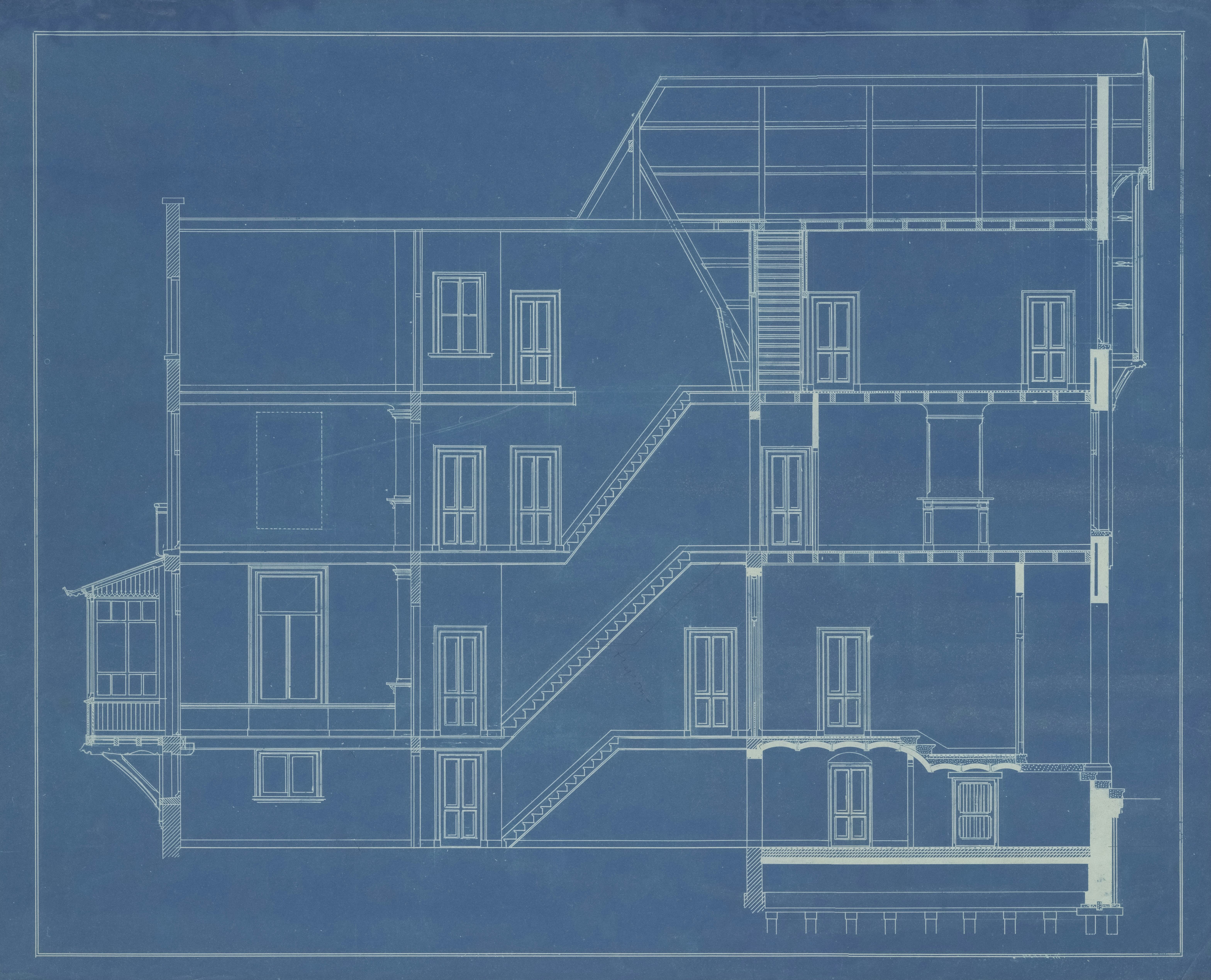Architectural blueprint of a multi-story building section showing staircases, doors, windows, and structural details.