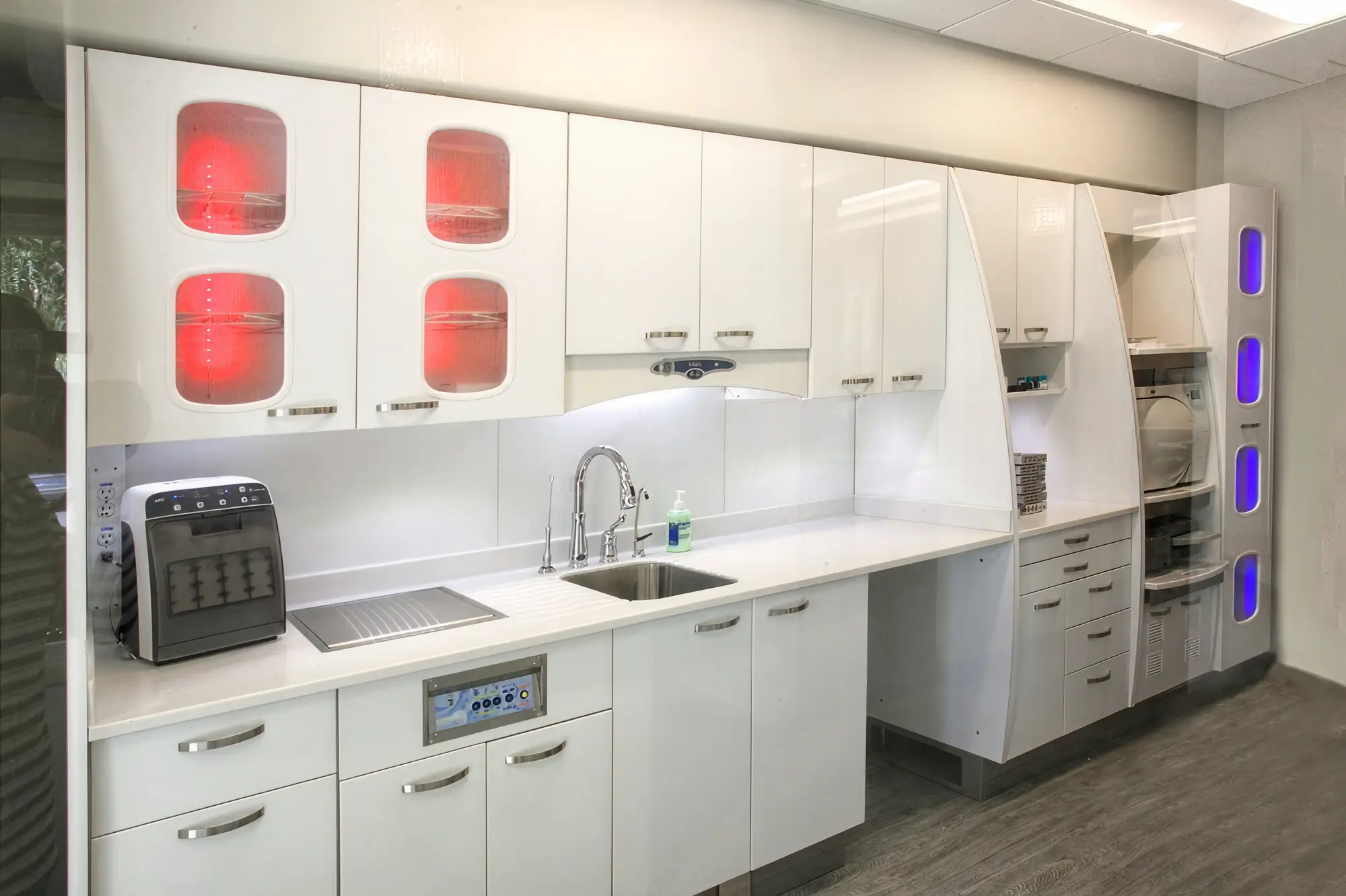 Sterilization and instrument processing area at Ortega Cottage Dentistry with UV sterilization units and white cabinetry
