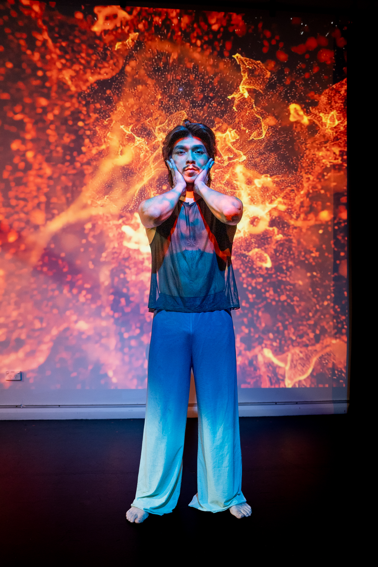 A performer works with smoke and gesture in Dancing with the Roots at Sydney Fringe 2026.