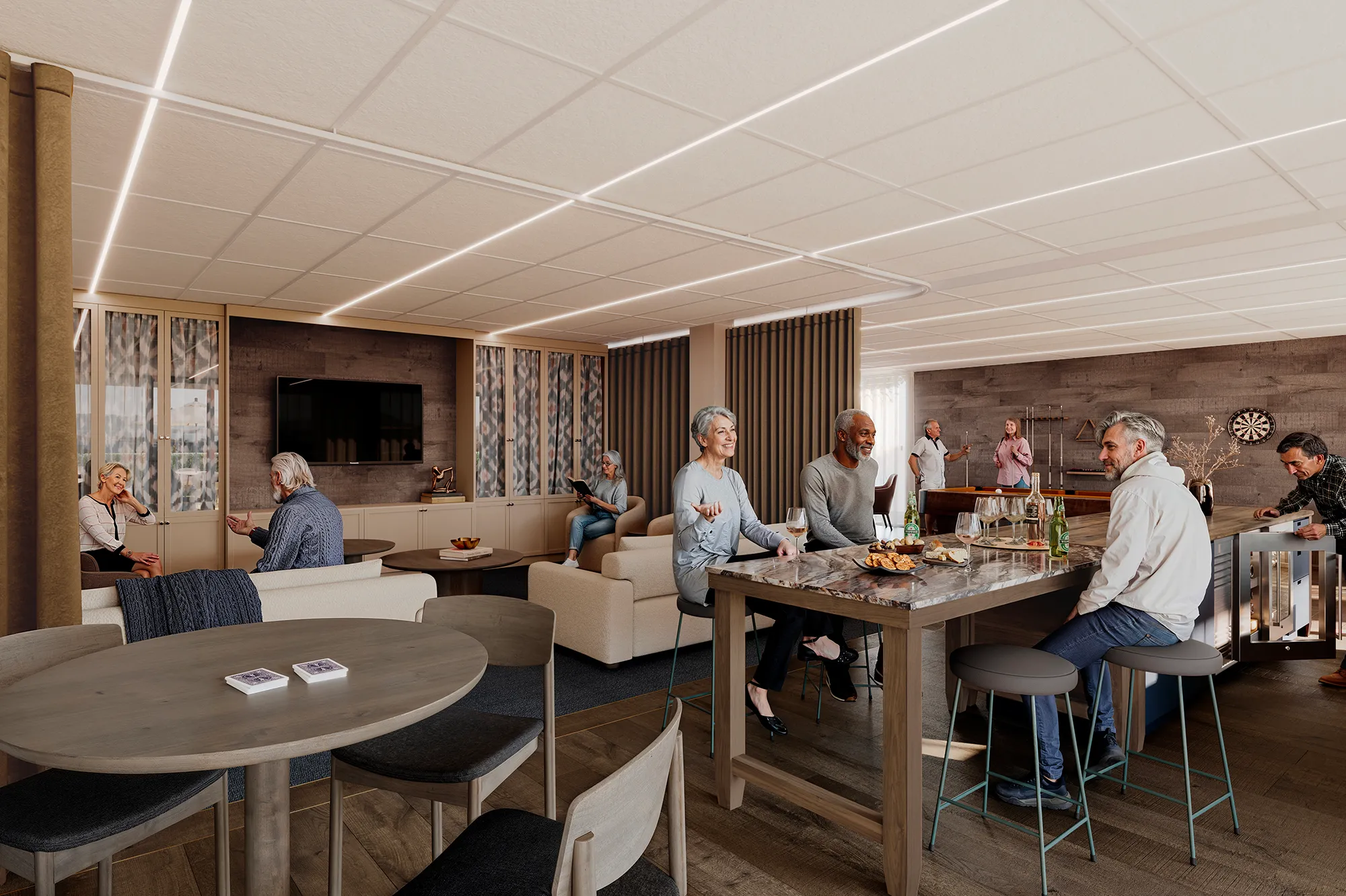 A modern residents' lounge with people socialising, sitting at a high table with snacks and drinks, playing billiards and darts in the background.