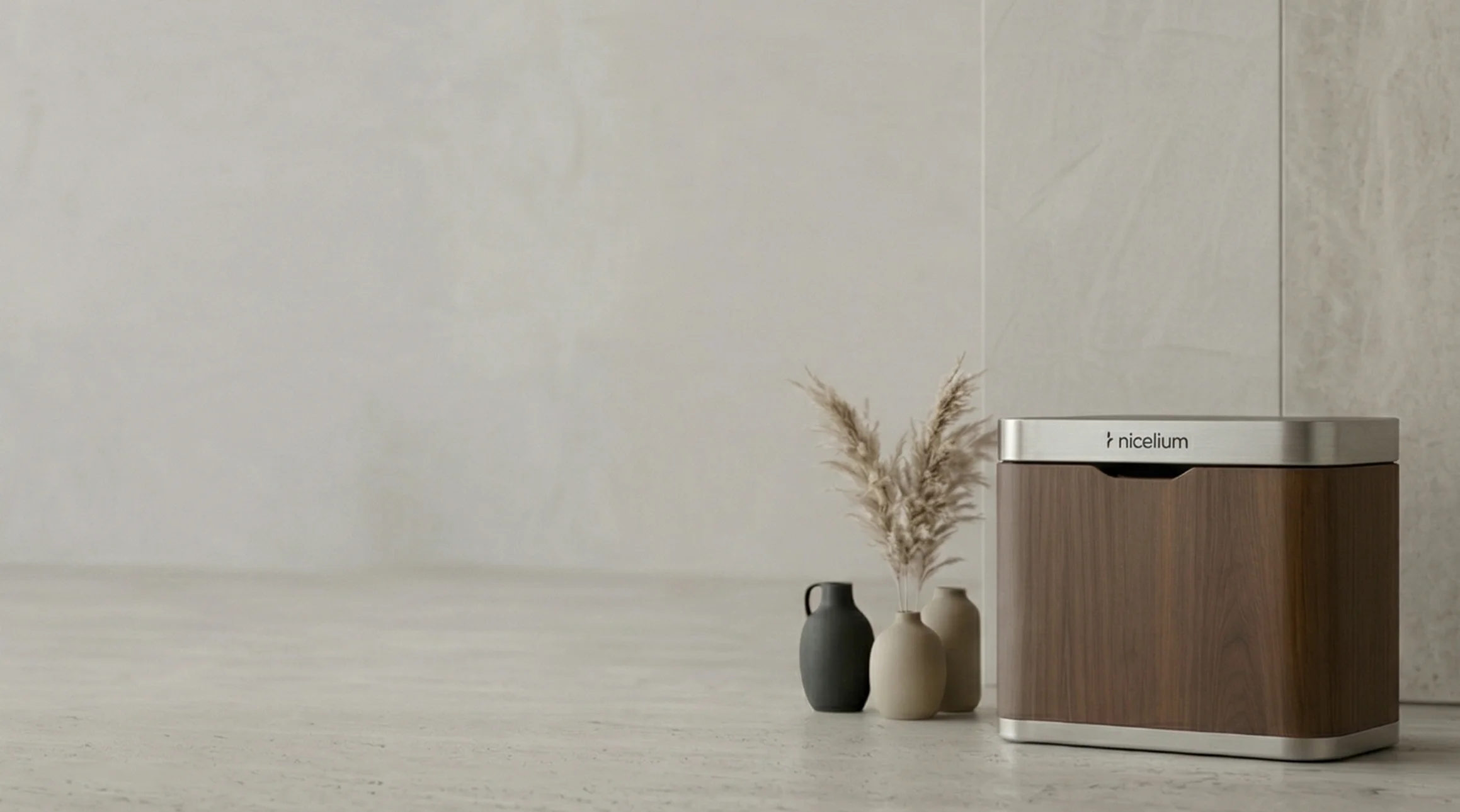 Modern rectangular wooden bin with a metallic top labeled 'nicelium' next to three small decorative vases on a light stone surface.