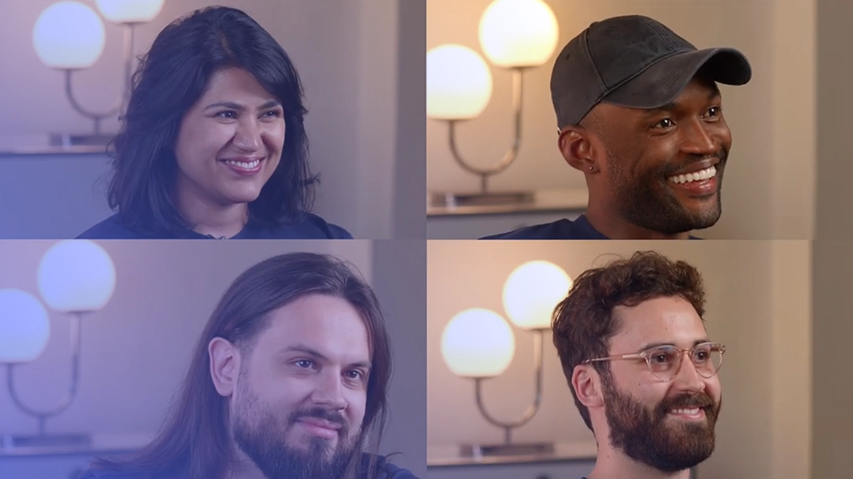 Four diverse people smiling, shown in a grid format with two women and two men in an indoor setting with lamps in the background.