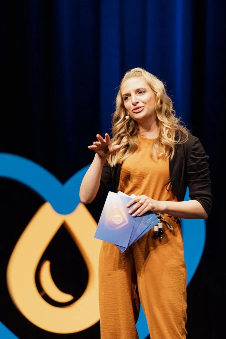 Janine Mehner hosting on stage