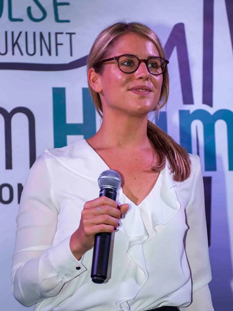 Janine Utsch hosting a panel event