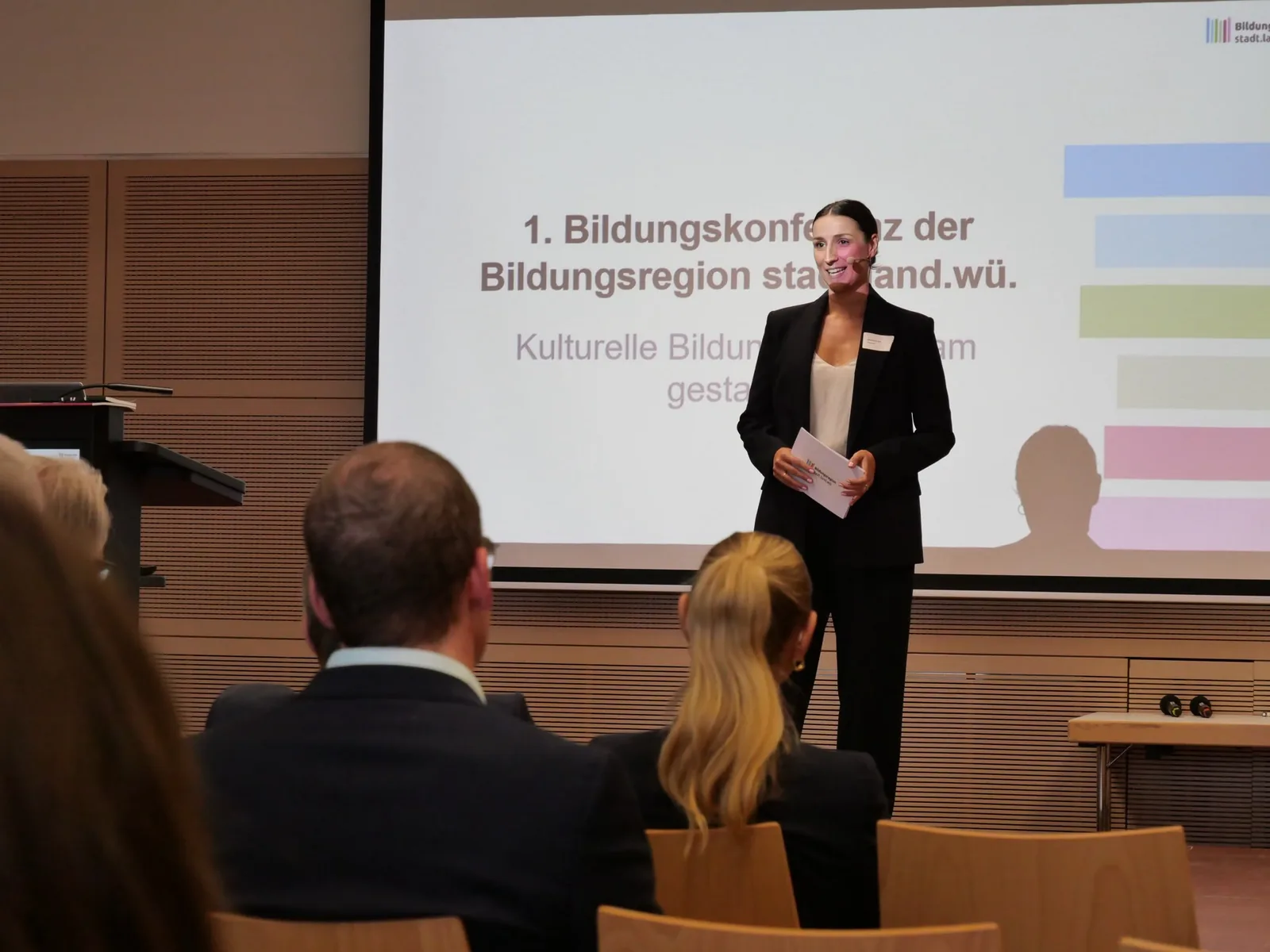 Madeleine Etti hosting an education conference