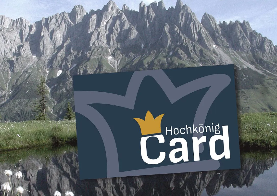 Hochkönig Card logo over a photo of green summer mountains