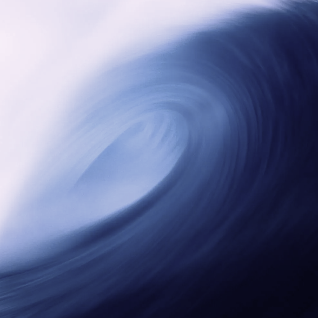 Abstract swirl of blue and white colors resembling a vortex or whirlpool.
