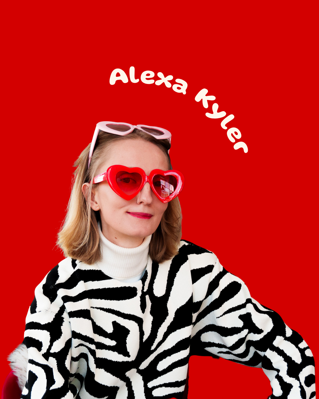 Woman with blonde hair wearing heart-shaped red sunglasses and a black and white zebra-striped sweater.