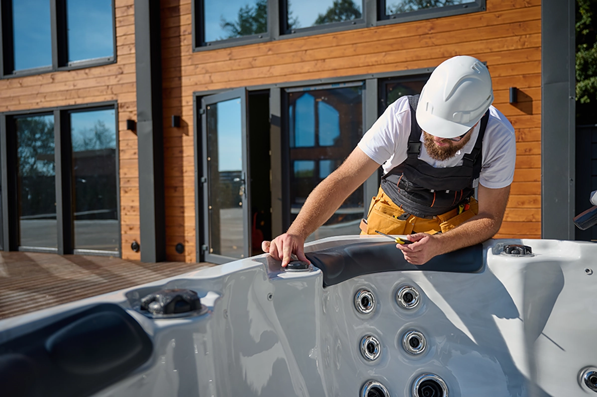 Technician repairing a hot tub in Ellensburg WA for Prestige Spa, providing professional hot tub repair and maintenance service