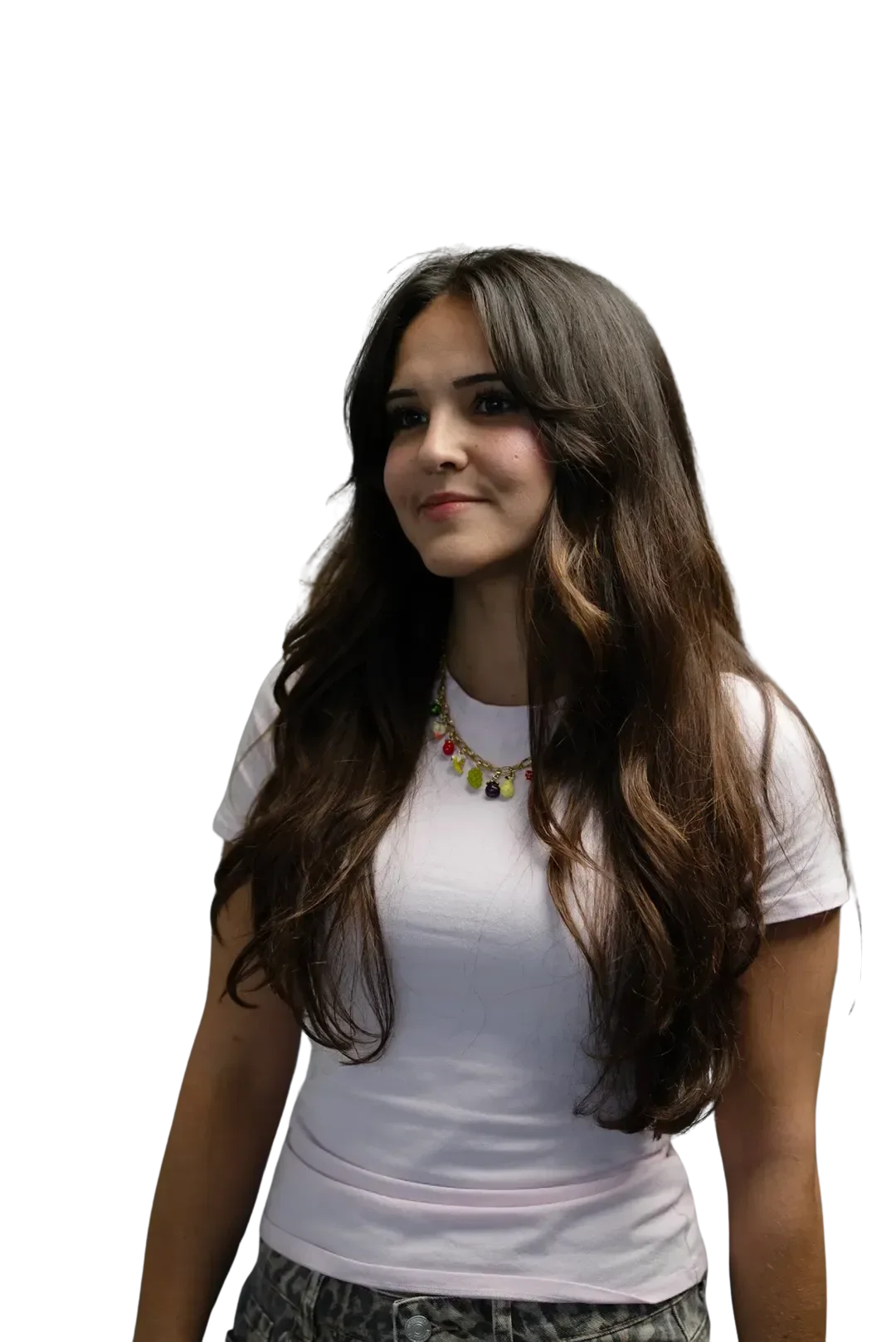 Young woman with long brown hair wearing a white t-shirt and colorful beaded necklace.