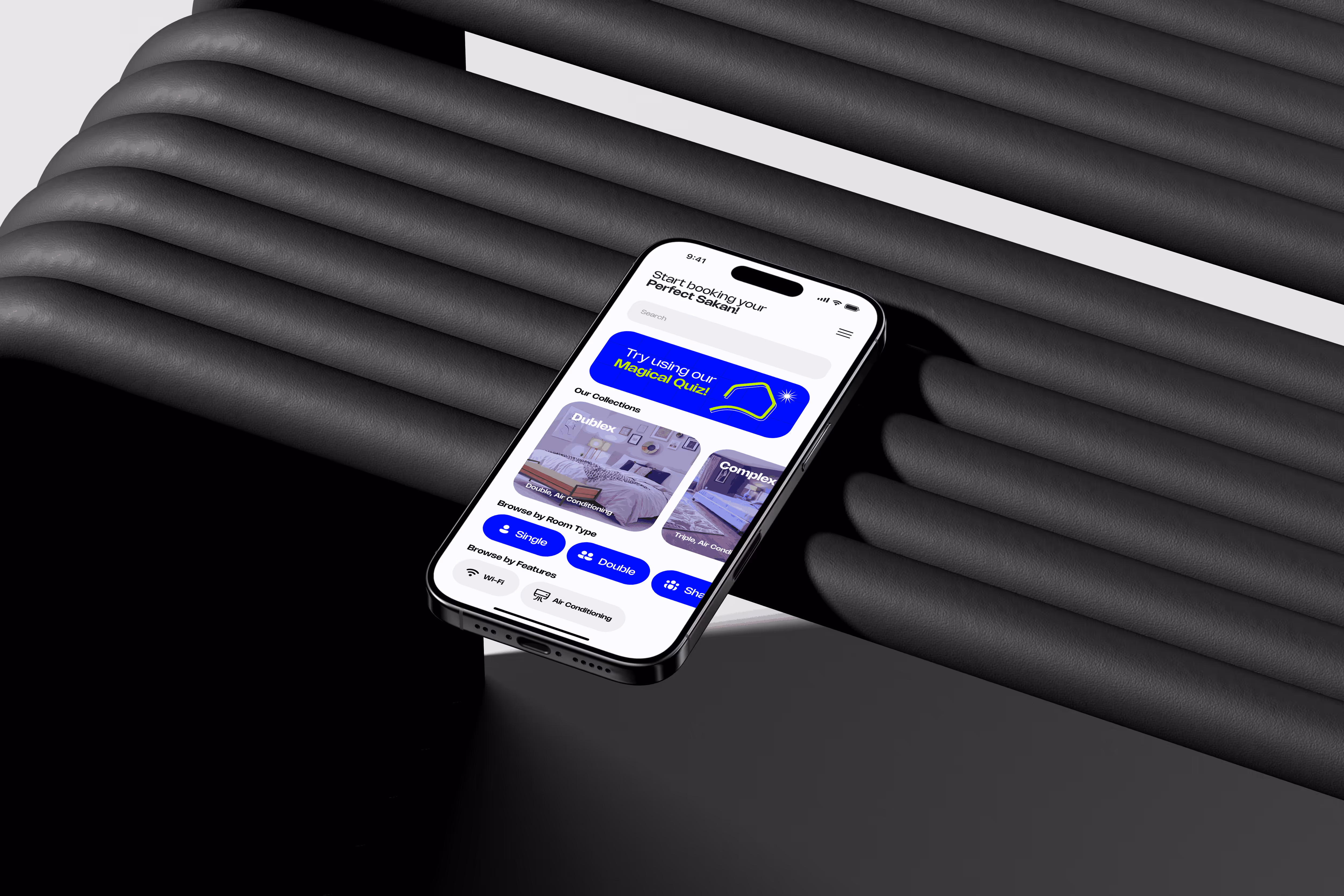 Isometric view of a smartphone on black ribbed surface displaying a room booking app with filter options.