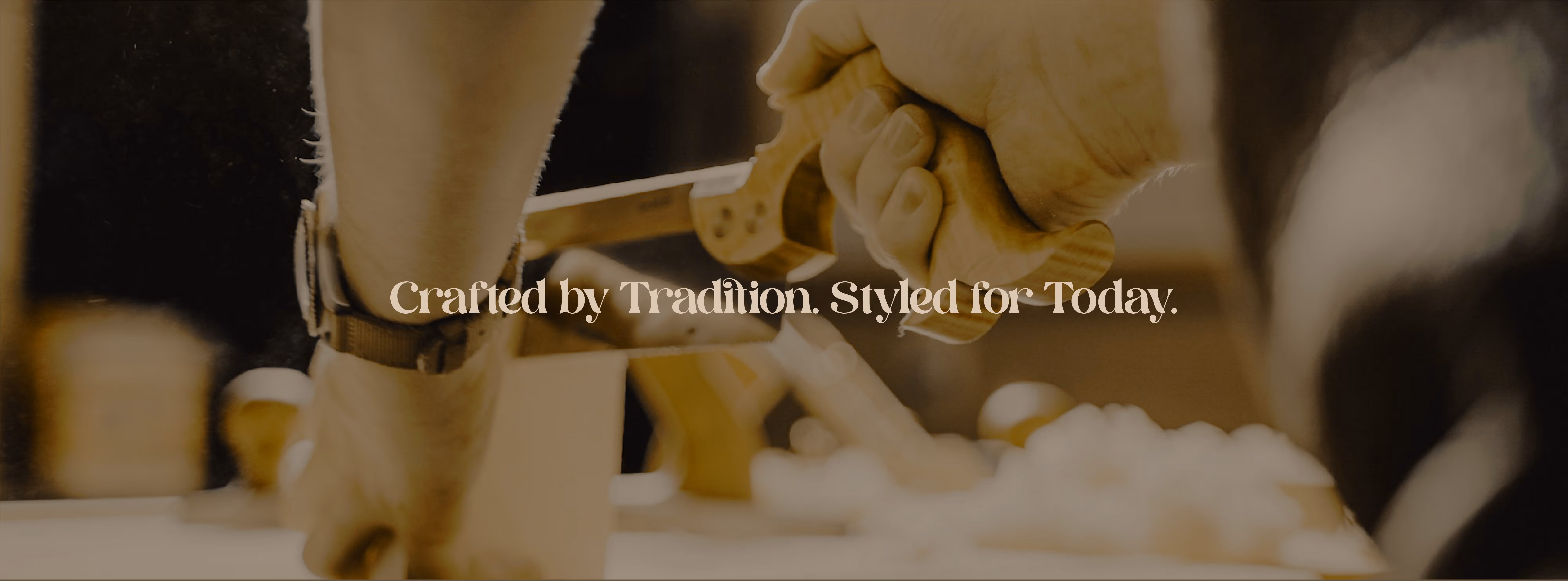 Hands working on woodworking with a saw, text reading Crafted by Tradition. Styled for Today.