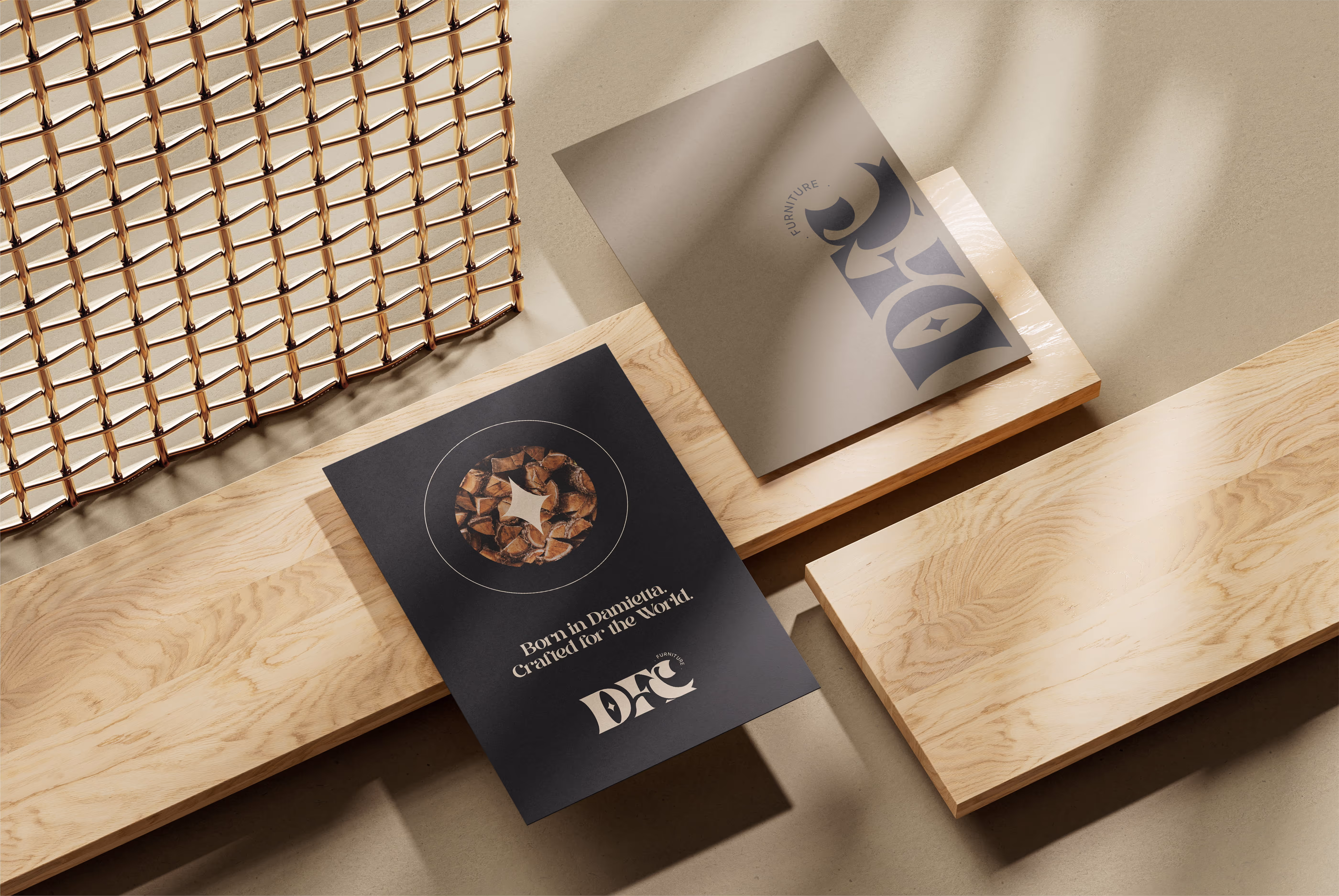 Two design flyers on light wood planks near a golden metal mesh, one showing leather pieces and text.
