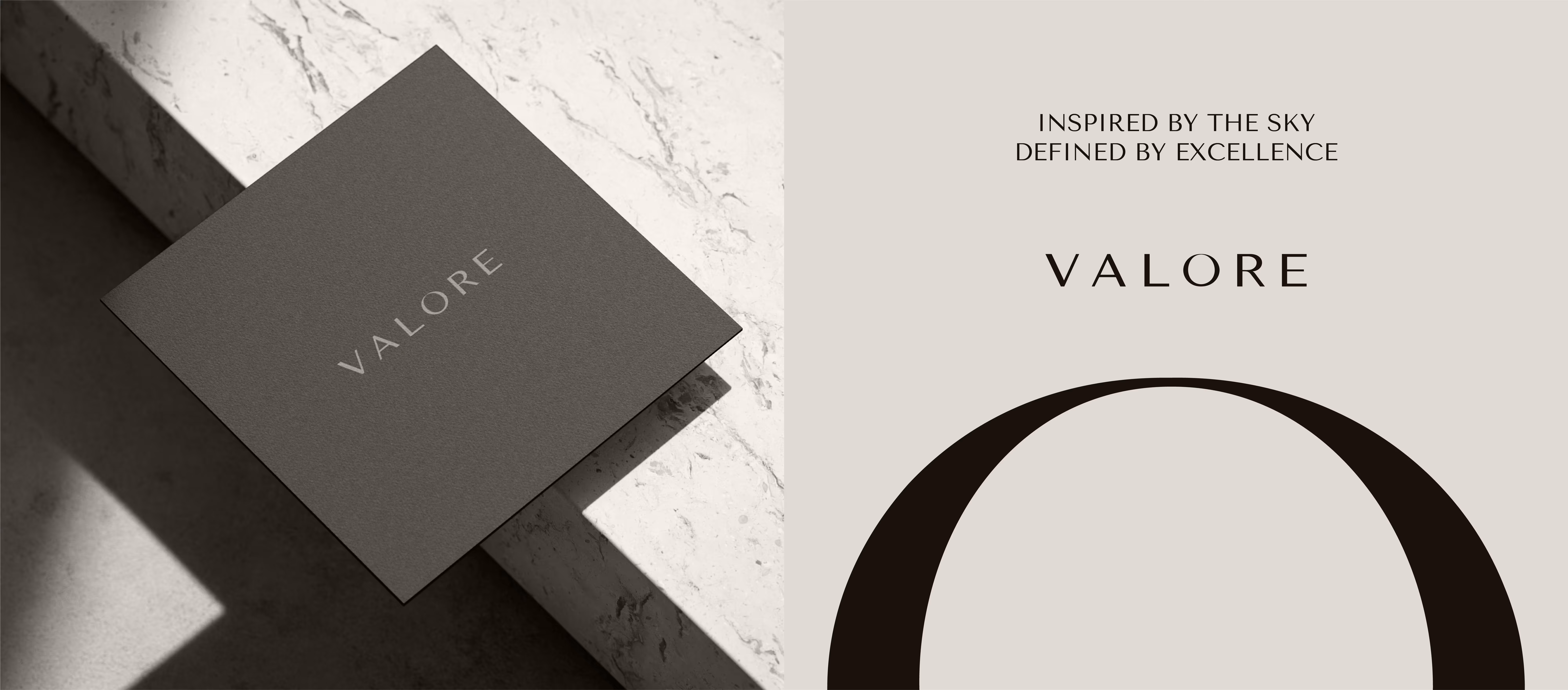 Dark gray square card with 'VALORE' on marble surface and text 'Inspired by the sky, defined by excellence'.