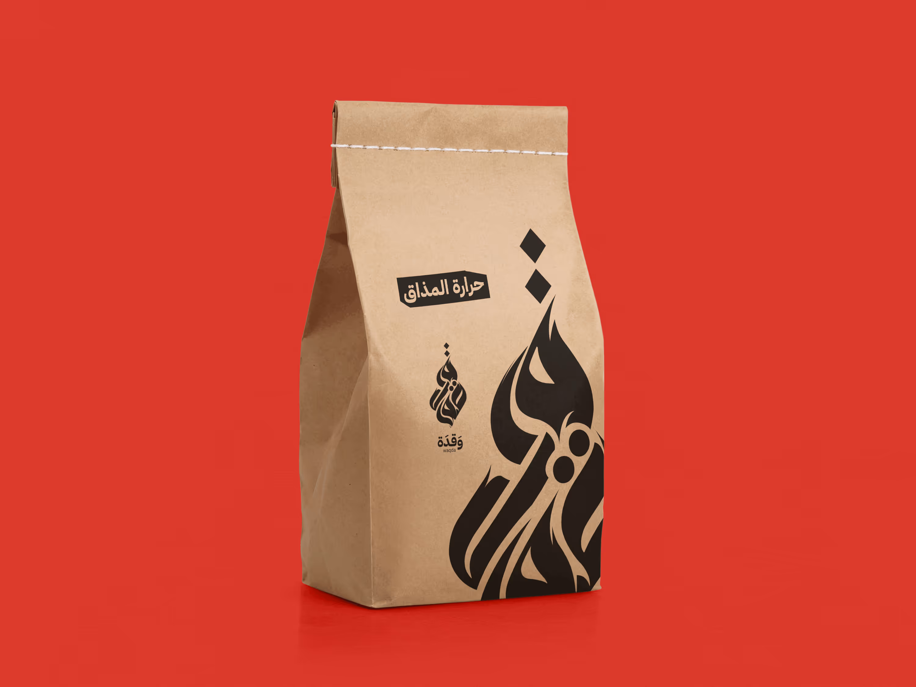 Brown stitched paper bag with black stylized Arabic calligraphy on a red background.