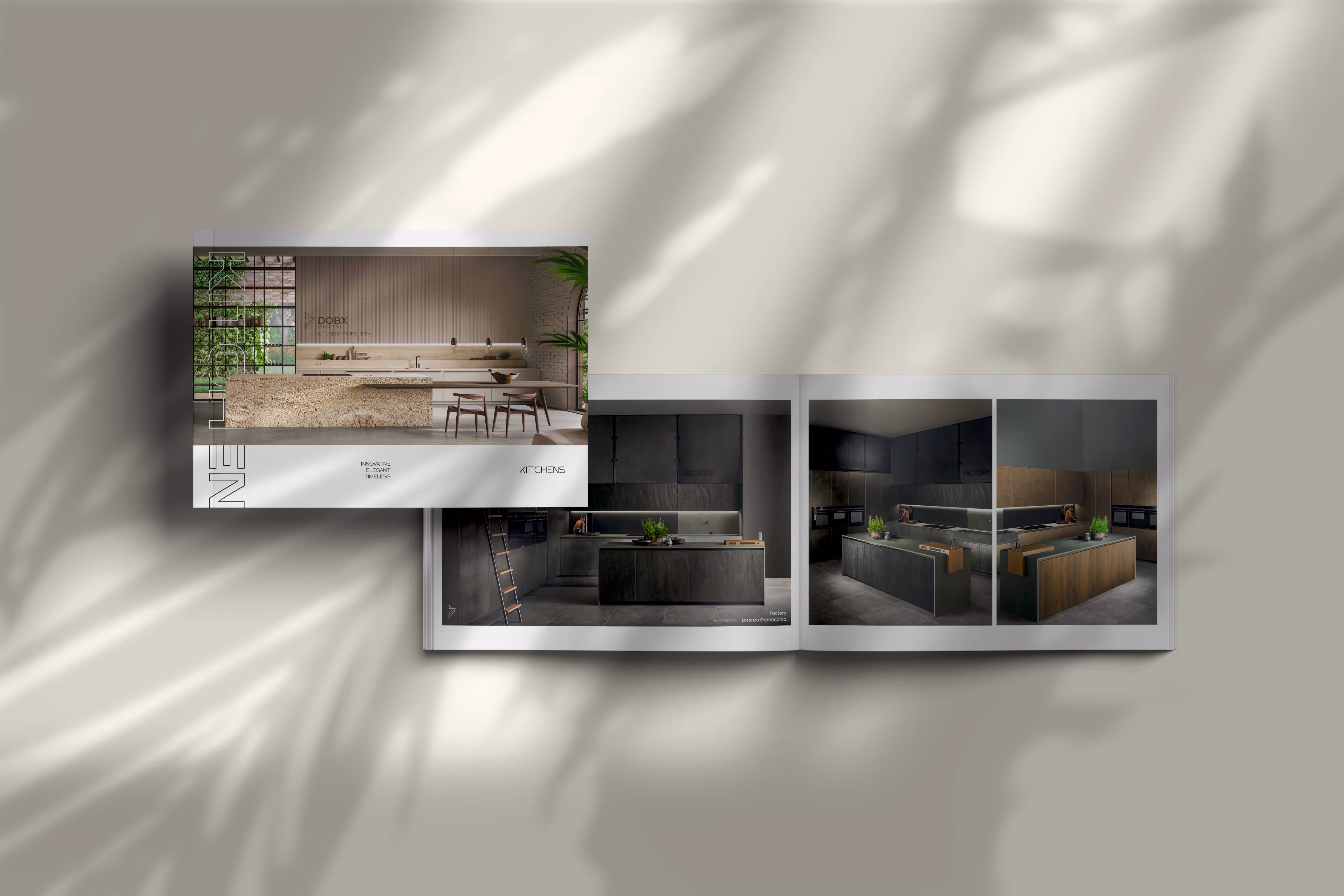 Open magazine displaying modern kitchen designs with dark cabinets and wood accents on a light surface.