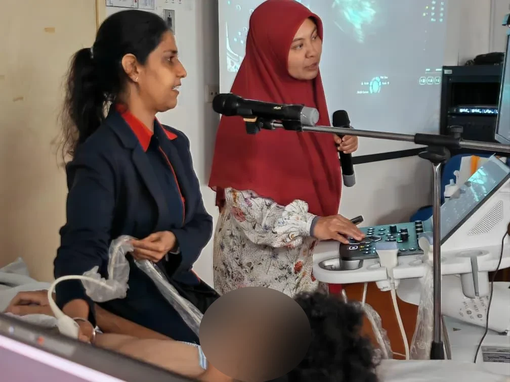 Faculty demonstration with microphone — KVAMU 2026, Hospital Selayang