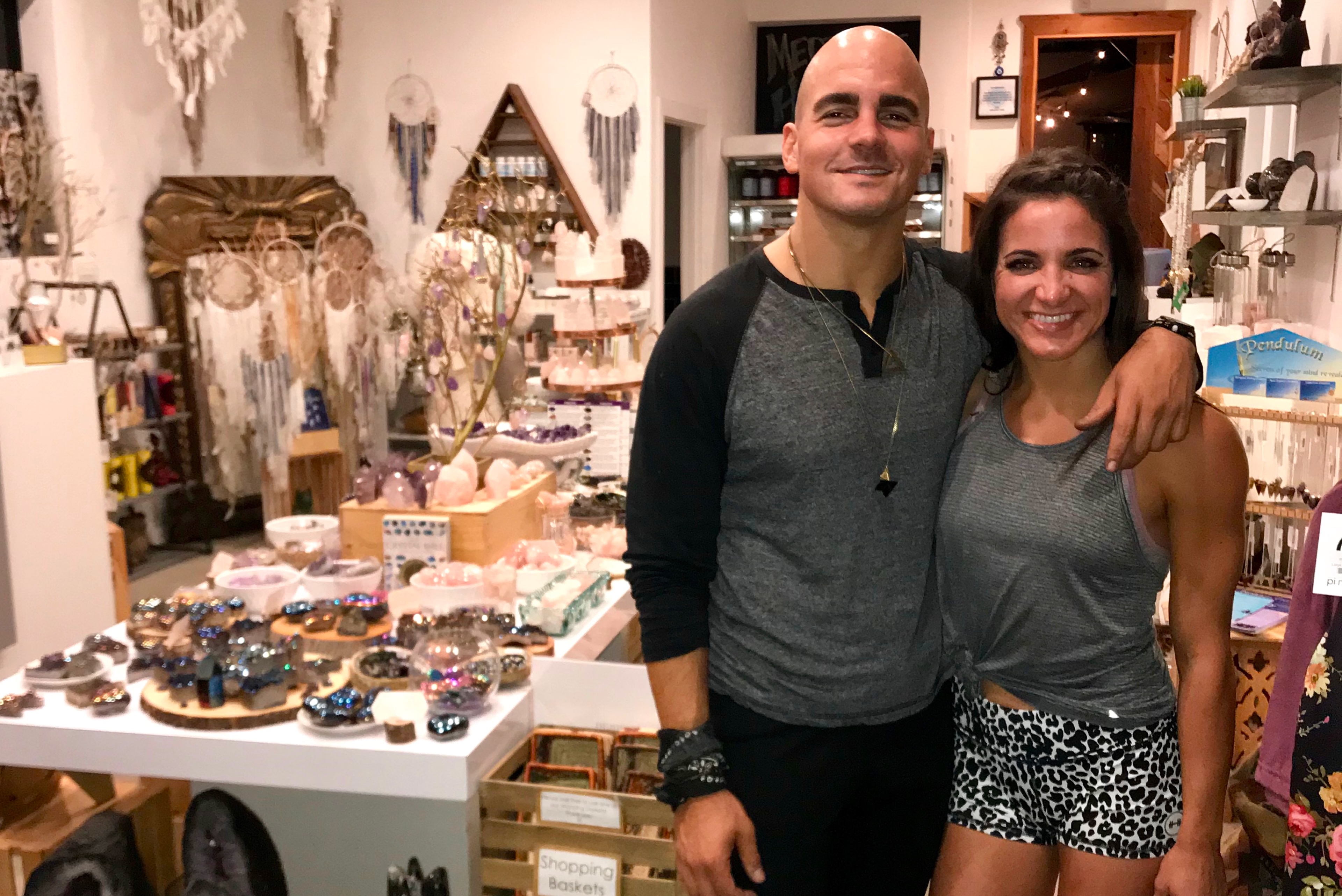 Annie with a friend in a crystal and wellness shop in the early days of her breathwork practice.