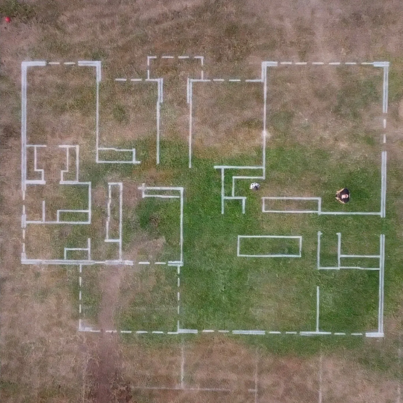 Family walking through a full-scale printed home layout on a vacant block in Townsville