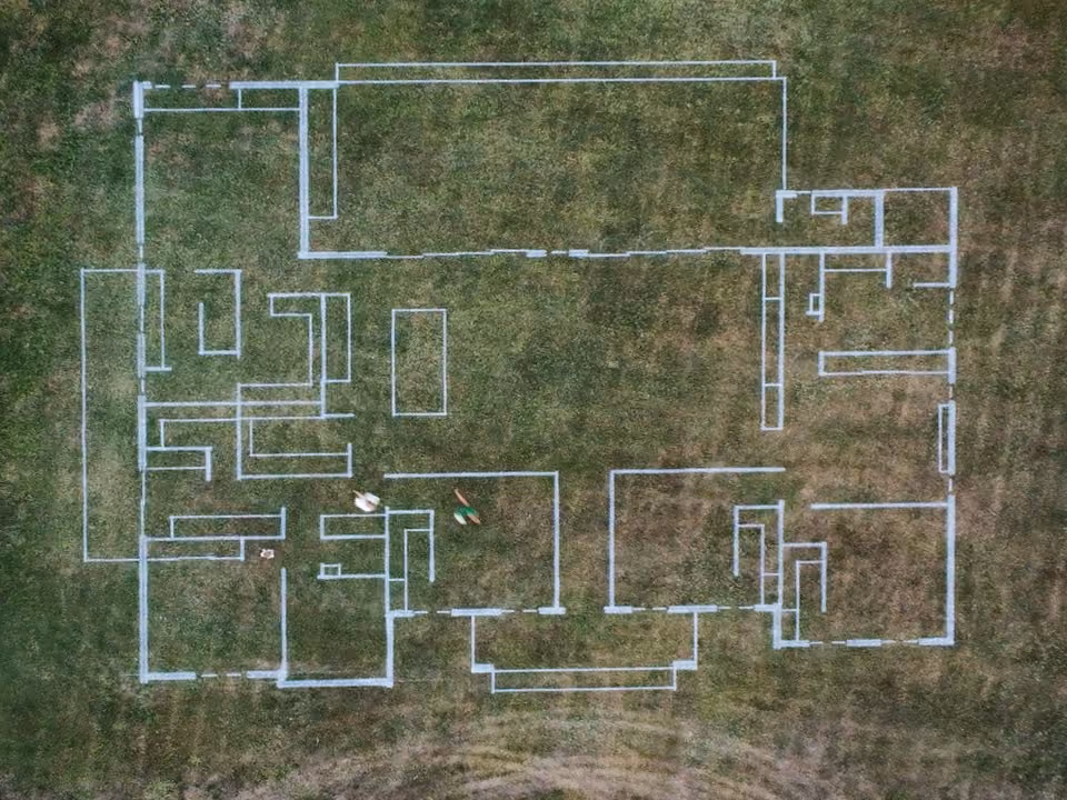 Aerial view of the full-scale house layout marked on the block.
