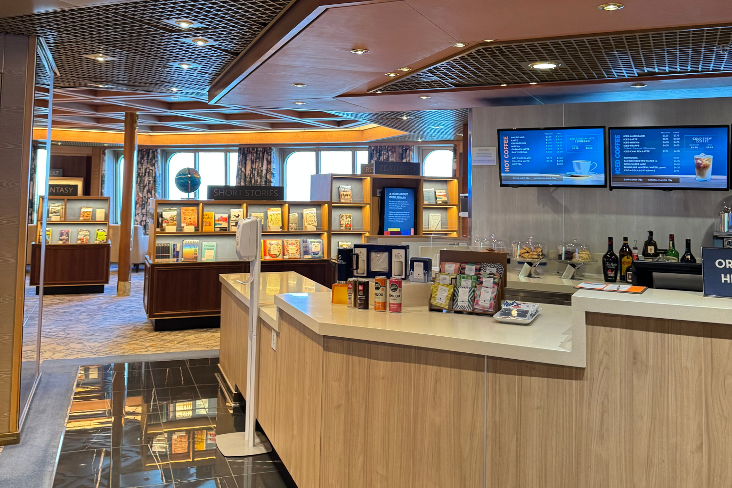Coffee shop next to library aboard cruise ship